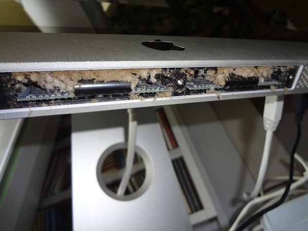 The RAM slots with the cover off on the bottom of the iMac.